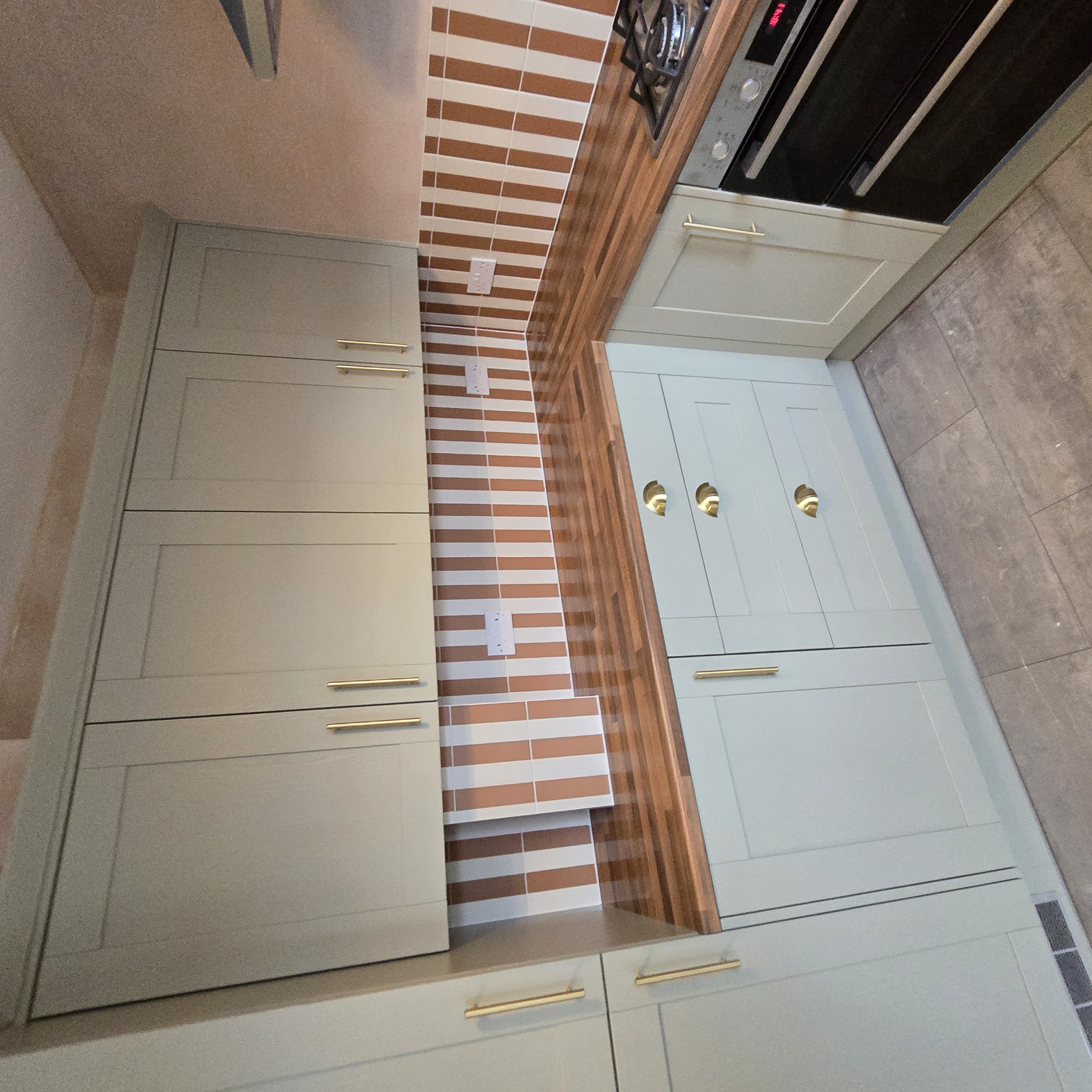 Completed sage green bespoke kitchen